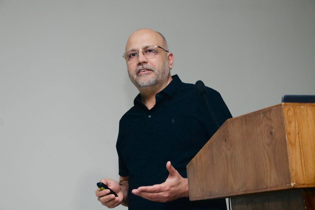 Dr Mujahid Jamil Khattak delivering a lecture at the podium during the Basic Science Course in Orthopaedics at Jinnah Postgraduate Medical Centre, Karachi