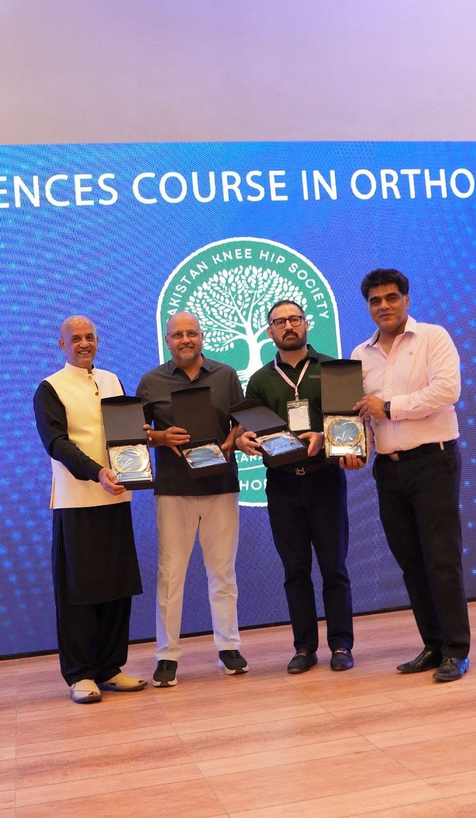 Faculty members receiving shields on stage at the Basic Sciences Course in Orthopaedics organised by the Pakistan Knee & Hip Society in Karachi