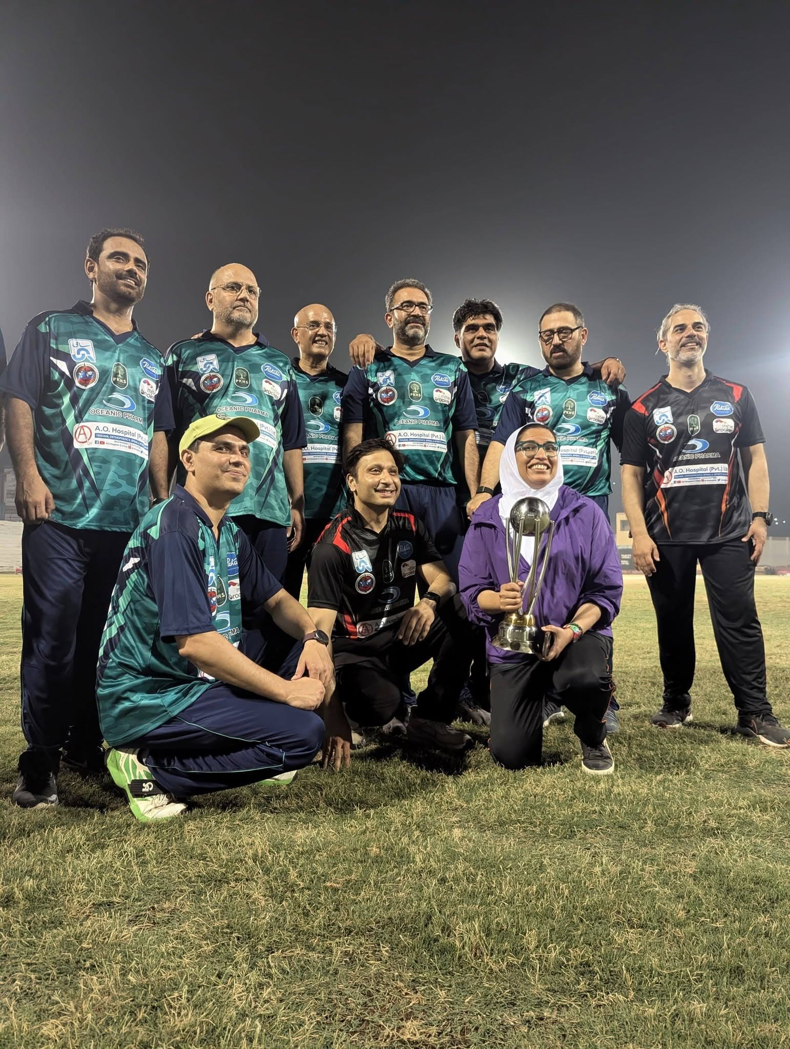Group photograph of the faculty team with a trophy following the Basic Science Course in Orthopaedics at Jinnah Postgraduate Medical Centre, Karachi